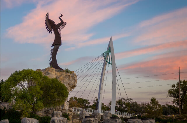 Wichita's Keeper of the Plains and bridge at sunset
