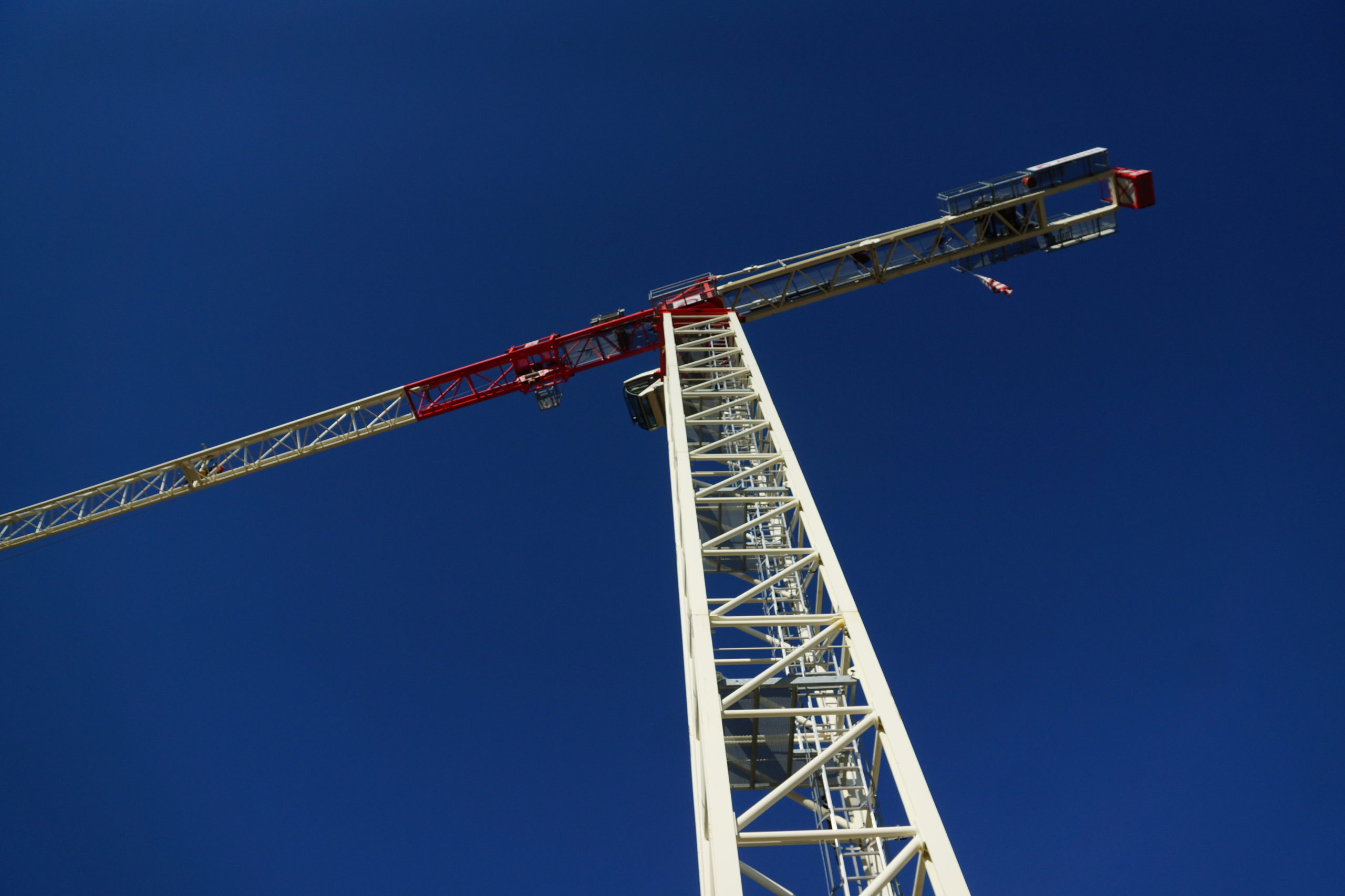 Image of a tower crane looking up from the ground.